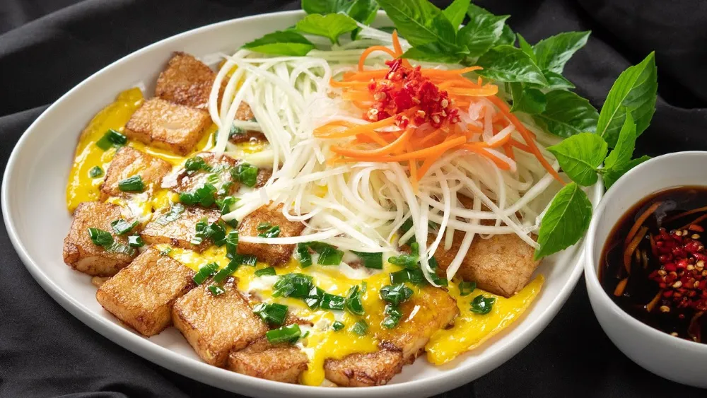 Bot Chien Vietnamese fried rice flour cakes with egg Saigon street food snack