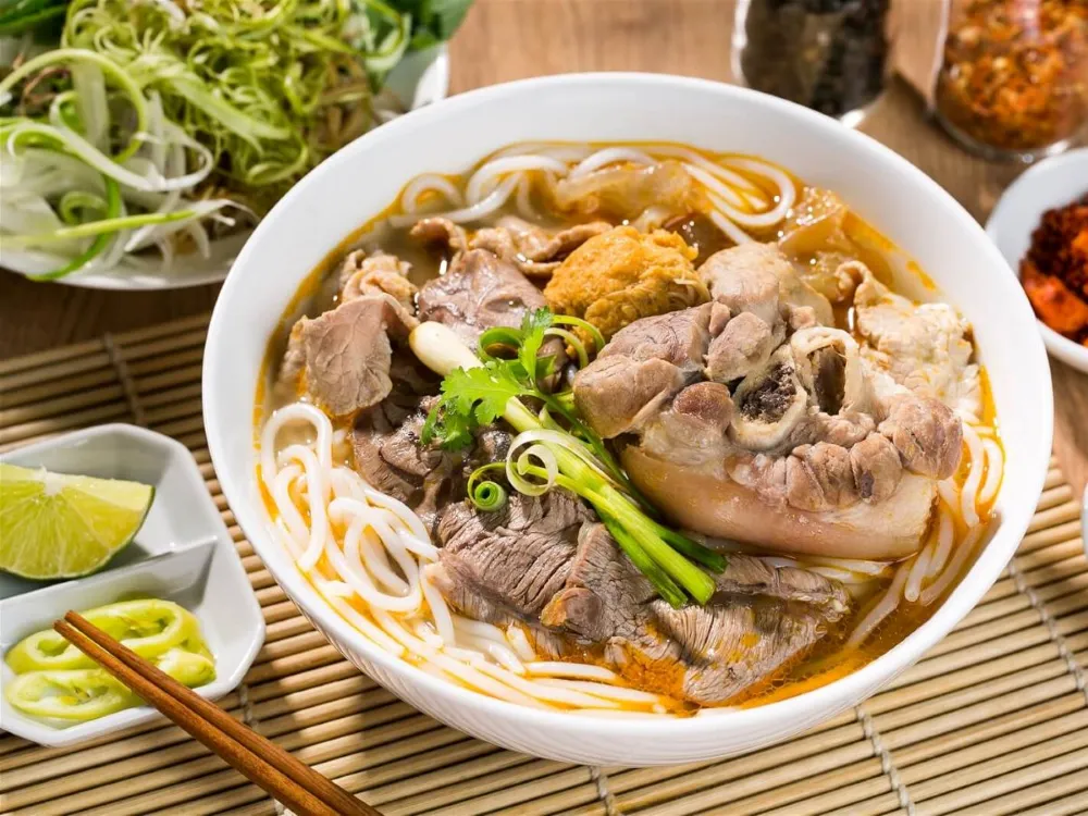 Bun Bo Hue spicy beef noodle soup iconic street food from Hue Vietnam