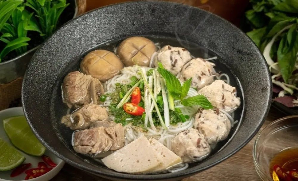 bun moc with pork meatballs and mushrooms in a light broth