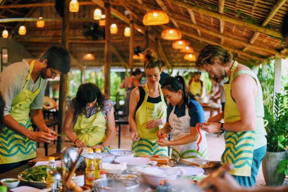 a Vietnamese cuisine cooking class in the open air kitchen of Tra Que Vegetable Village