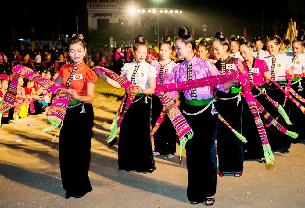 Thai ethnic woman wearing hand embroidered scarf in Mai Chau valley Vietnam
