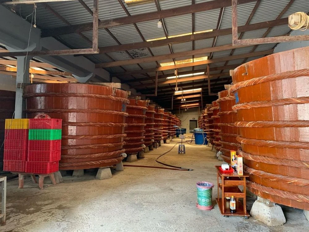 Huge wooden vats used for fermenting premium traditional fish sauce on Phu Quoc island