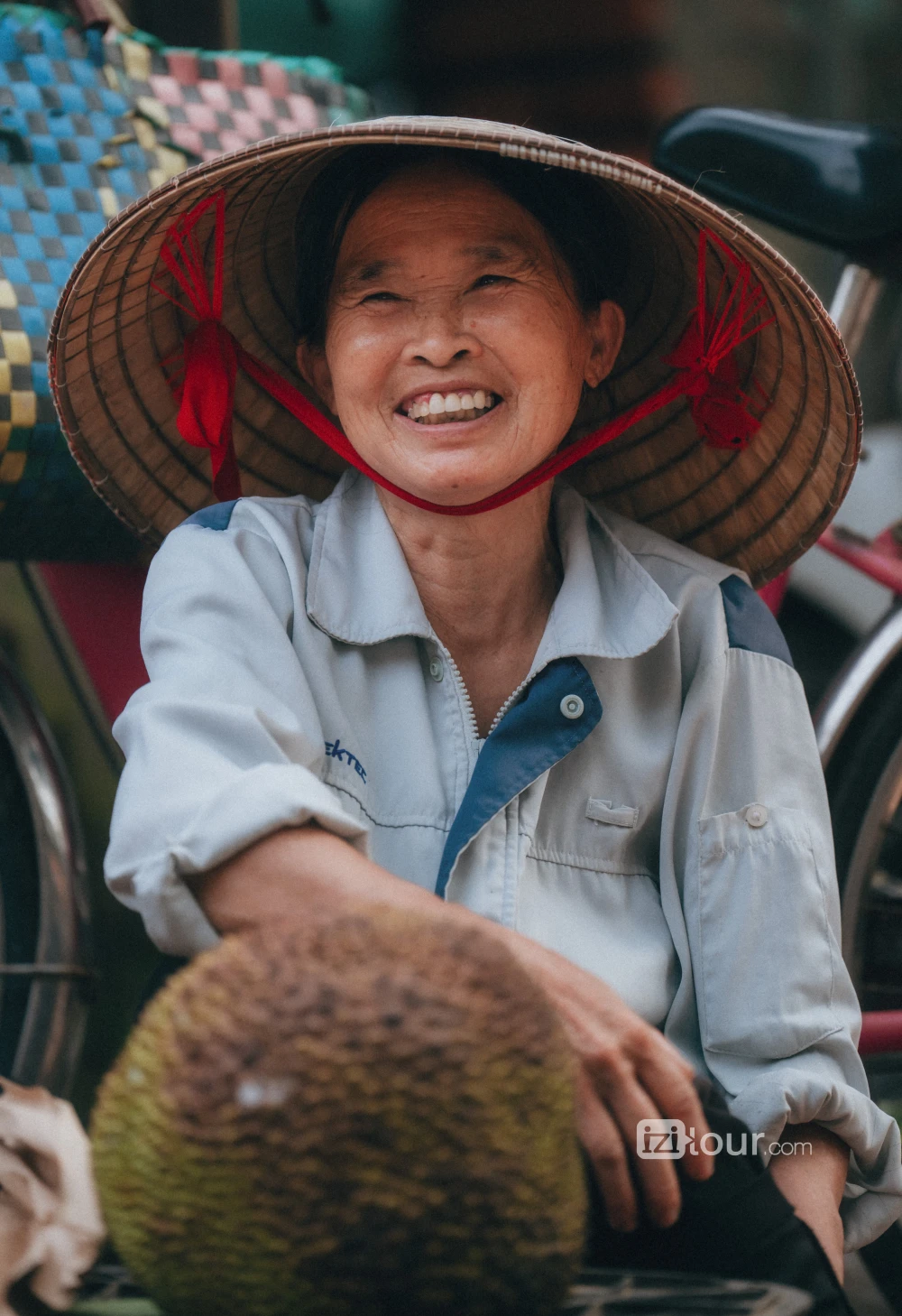 A warm smile from a Vietnamese woman welcoming visitors