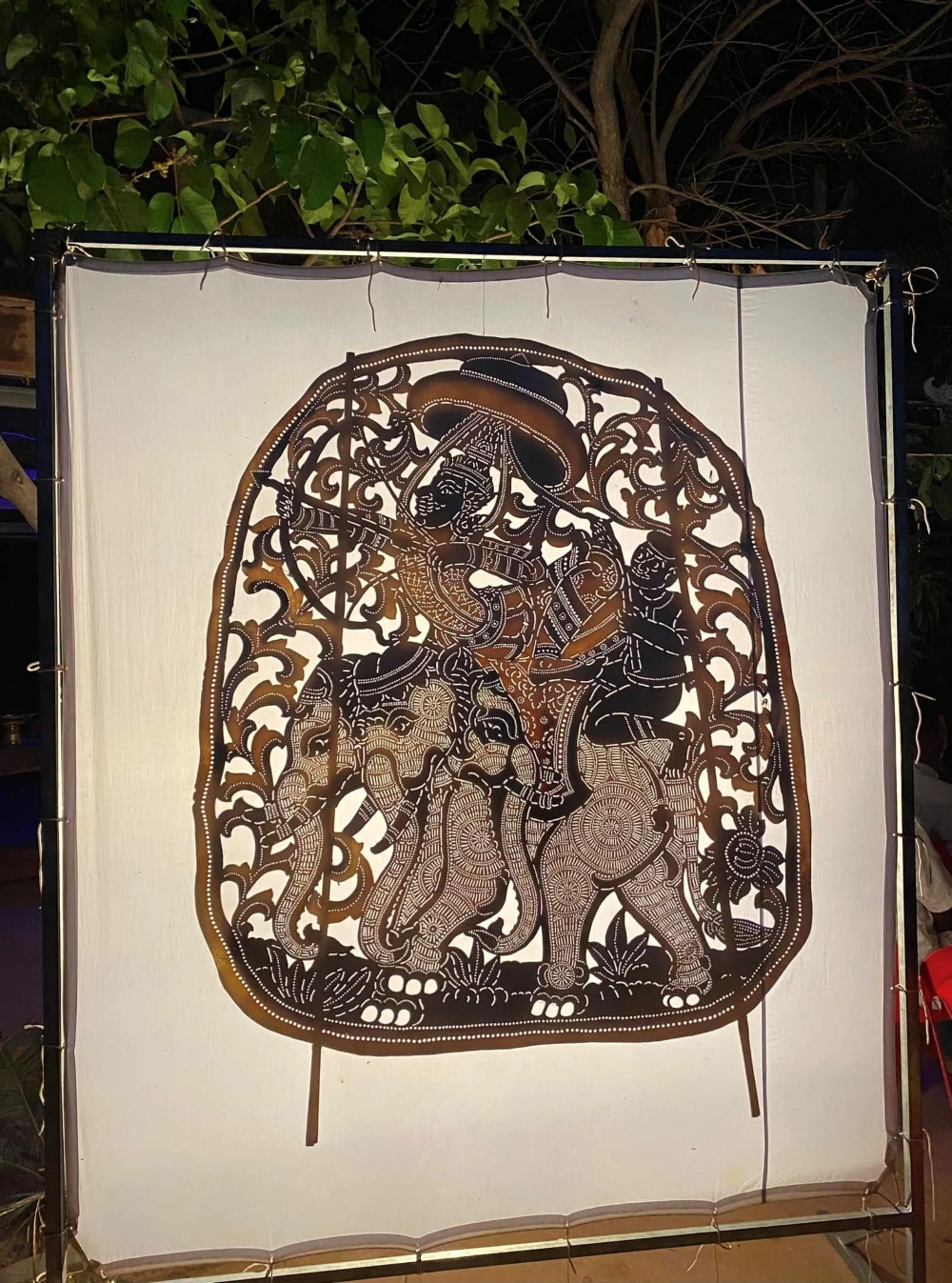 a large hand-carved cowhide puppet for the sacred Sbek Thom shadow theatre