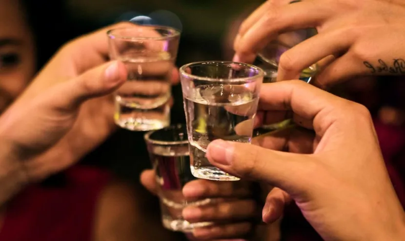 cup being filled with snake wine