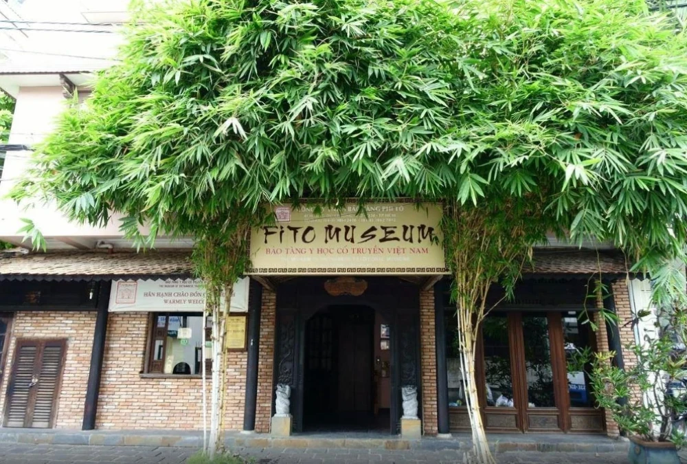 Front view of FITO Museum in Ho Chi Minh City showing traditional Vietnamese wooden architecture