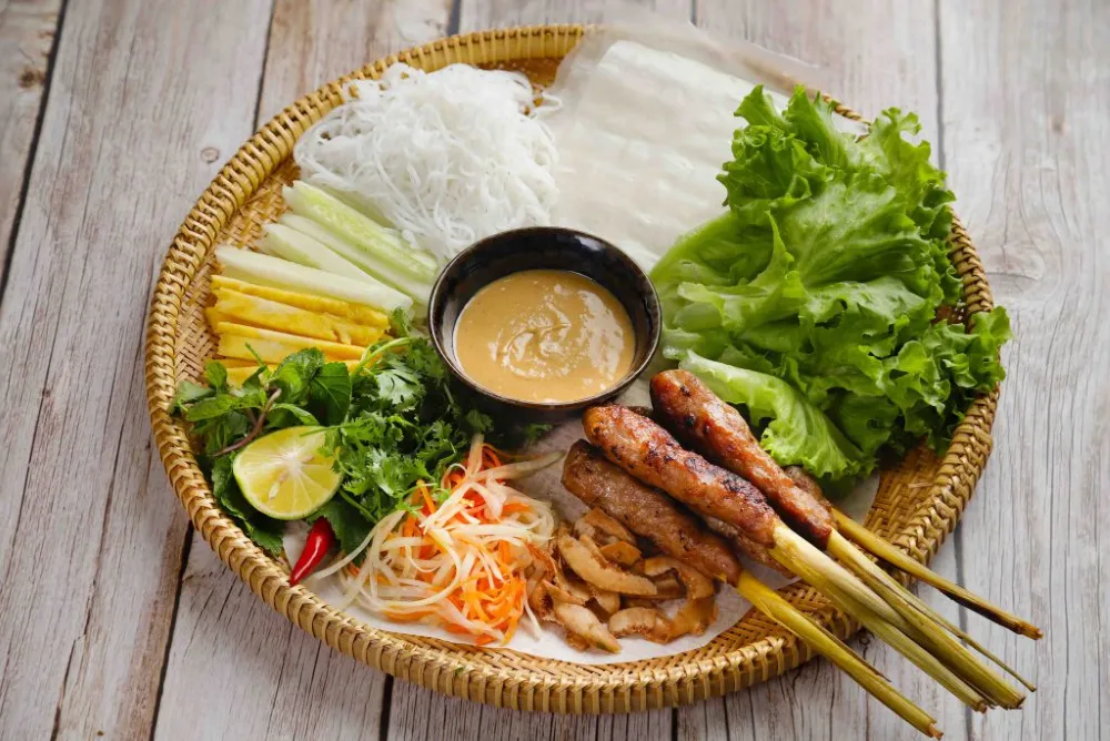 Nem Lui Hue grilled pork skewers with rice paper traditional central Vietnamese street food