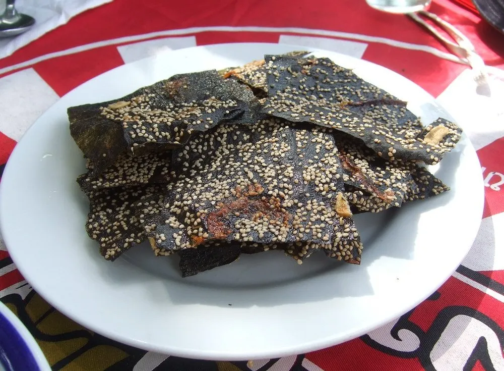 crispy sheets of Kaipen Laotian river weed fried and served as a snack with a dipping sauce, a specialty from the Mekong