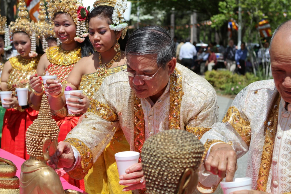 Vibrant street celebrations during Khmer New Year in Cambodia with people in traditional dress