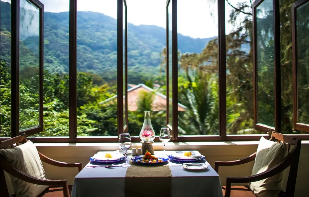 dining with view to lush tropical garden at Poulo Condor Resort