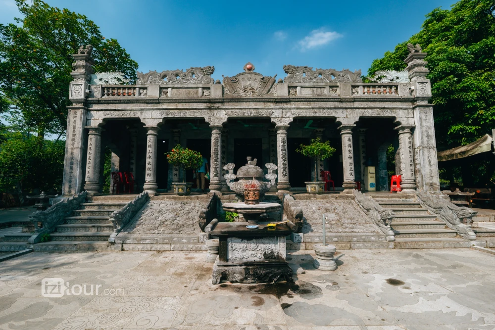 Traditional blue stone architecture of the Thai Vi Temple in Ninh Binh.