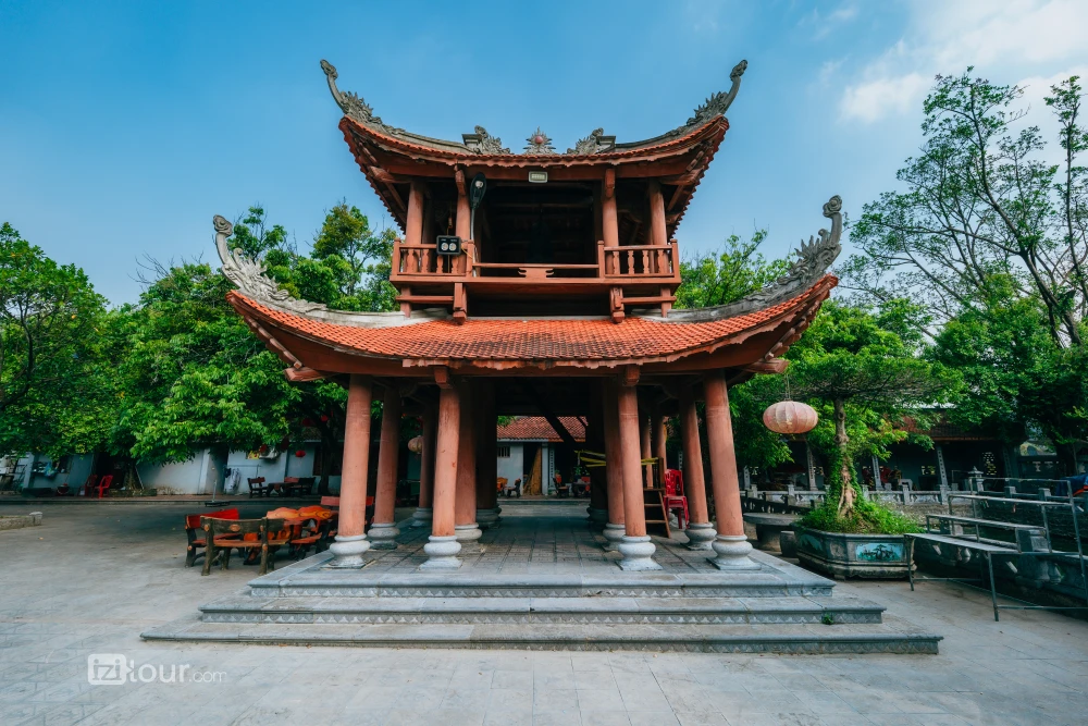 Two-tiered bell tower of the Thai Vi Temple, with its upturned roofs.