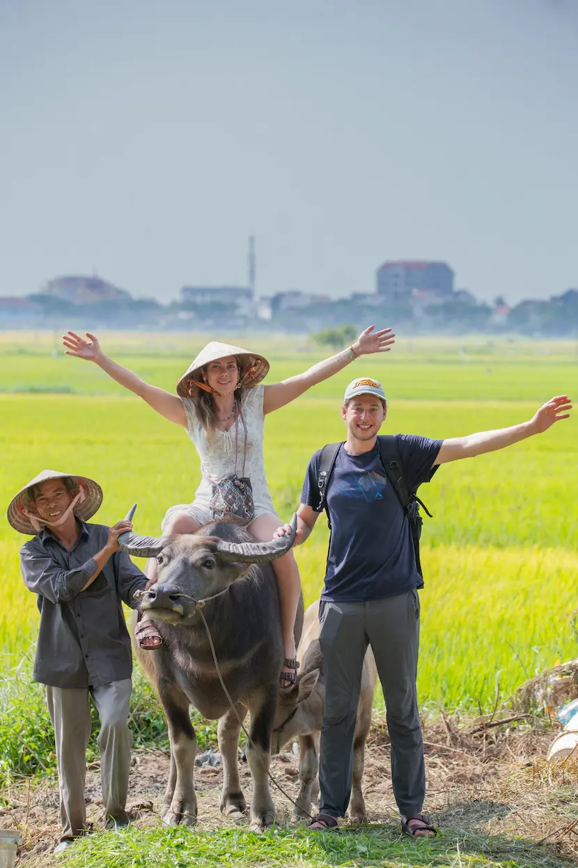 visitors enjoy their trip to Hoi An rice fields