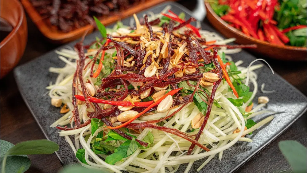 Nom Bo Kho Vietnamese green papaya salad with dried beef popular Hanoi snack