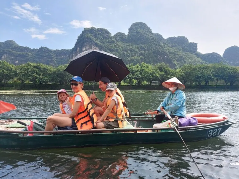 happy family on a boat tour in ninh binh vietnam