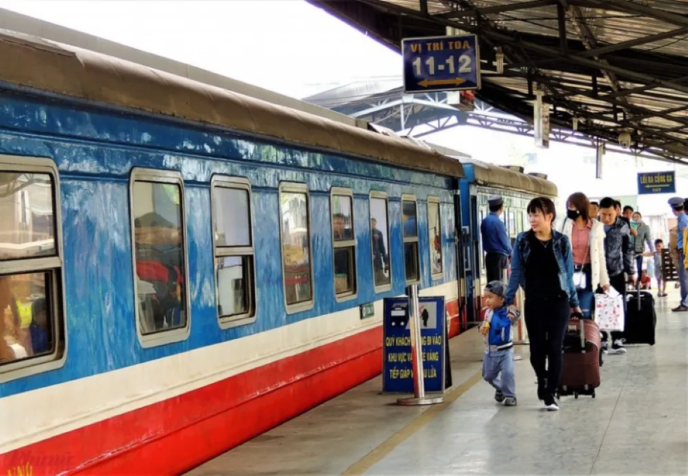 Passengers boarding the Reunification Express train at Hanoi Railway Station