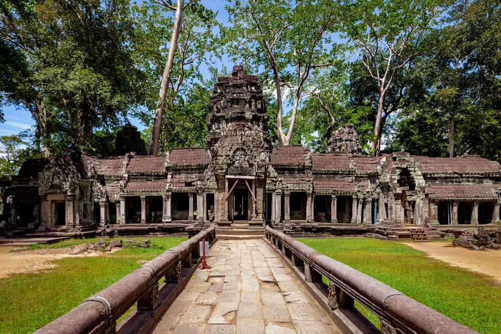 Stone gateway of Ta Prohm featuring Bayon-style carvings